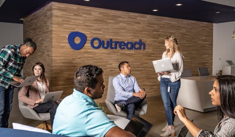 Outreach team members chatting in their lobby