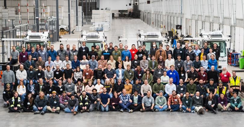 company photo for outrider inside a warehouse-like building