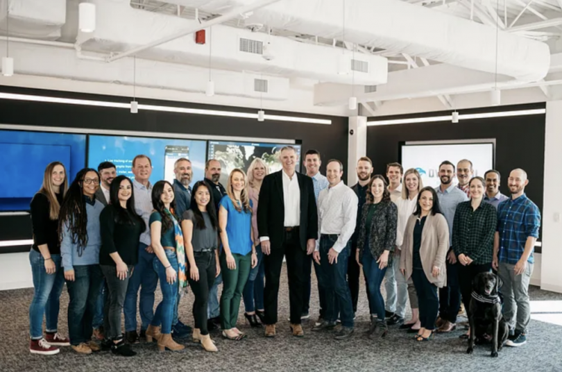A group of Overhaul employees together in the office.