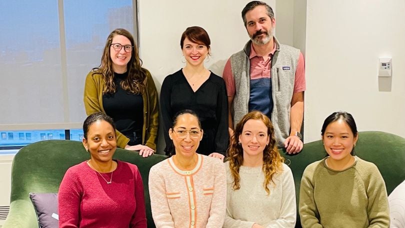ActionIQ team members pose for a group photo. 