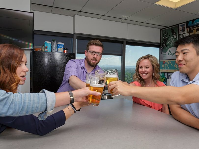 Pax8 staff enjoy beers in the office