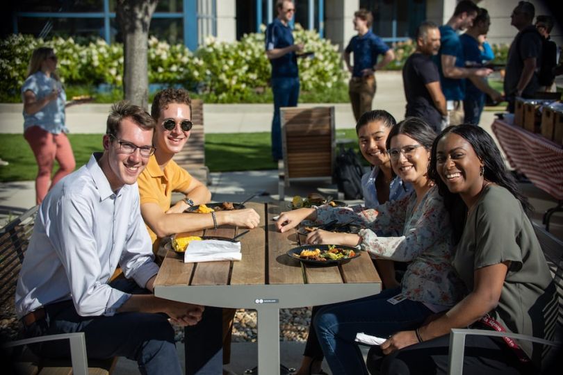 Paylocity team members seated outside