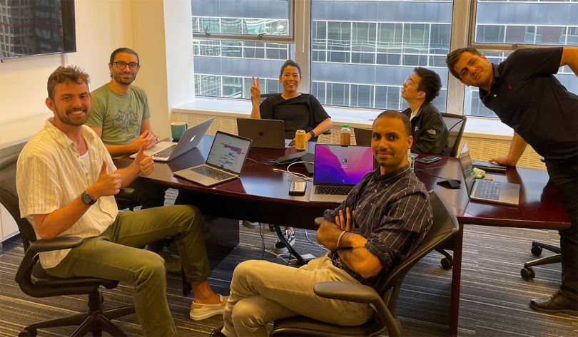 Prescriptive Data colleagues having a team huddle in the office