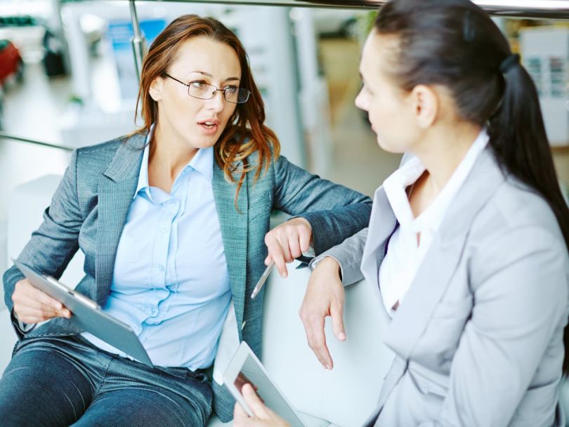 Two professional looking women converse