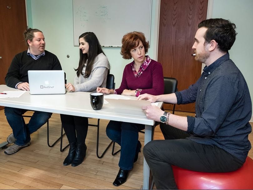 RedShelf team working at a table