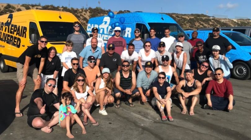 RepairSmith team members at the beach
