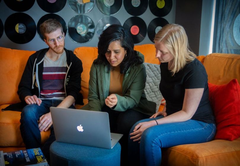 Reverb team members working at computer