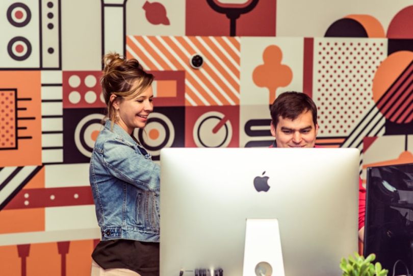 Reverb team members working at a computer