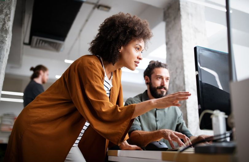 Programmers collaborating at an IT company developing apps