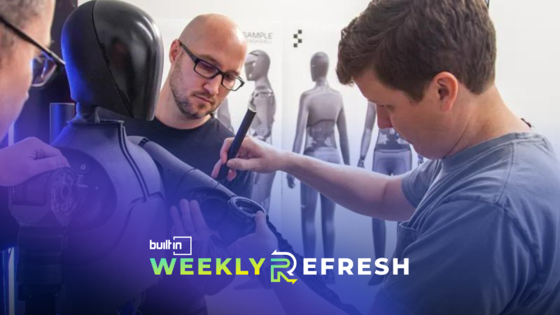 Figure team members work on a humanoid robot.