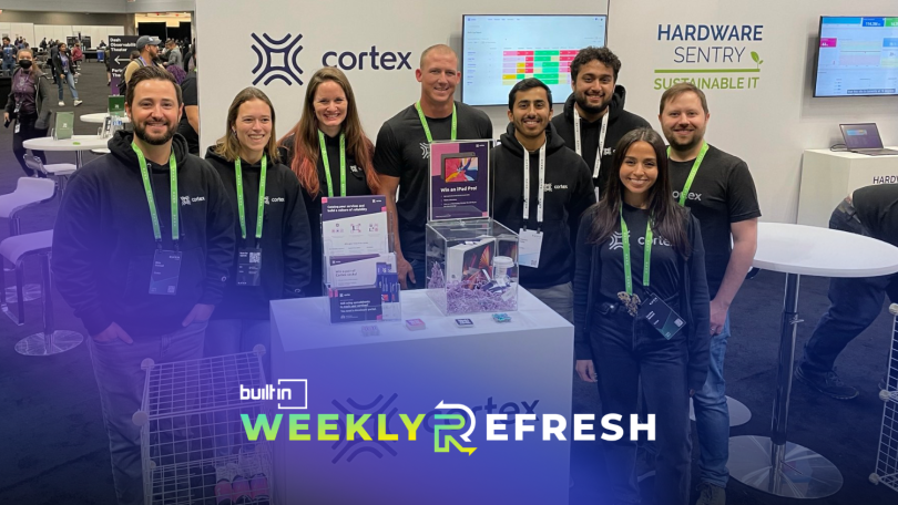 Cortex team members pose for a photo at a conference.