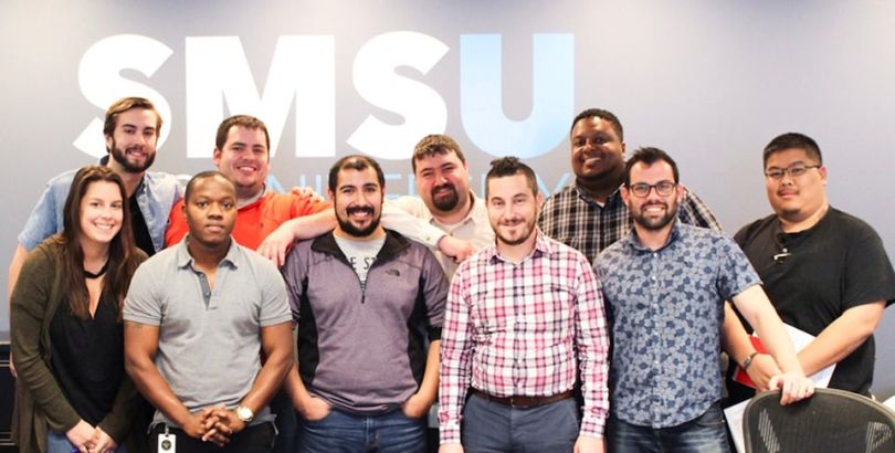 SMS Assist team posing for photo