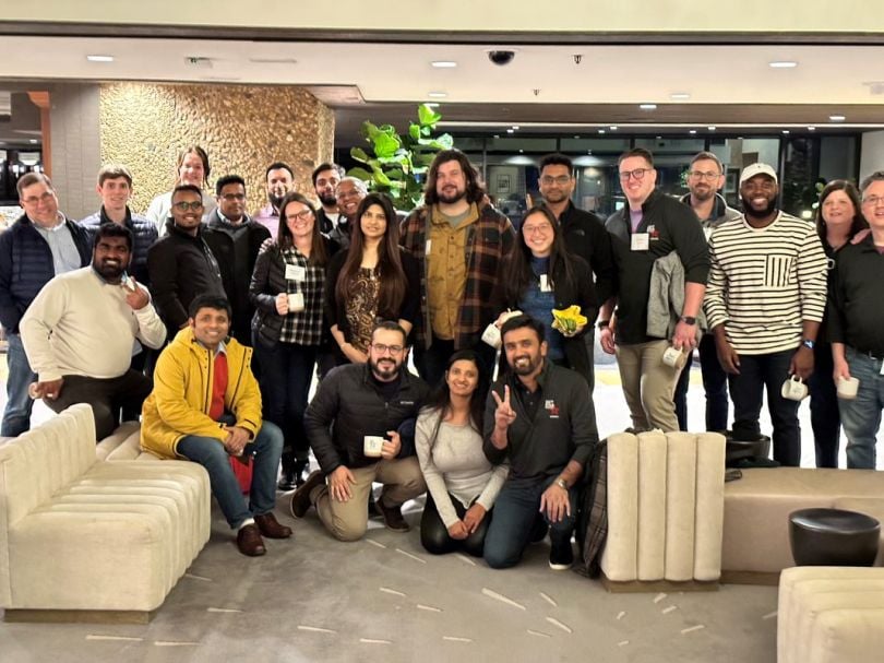 The Kraft Heinz Company team photo in a lobby with white couches