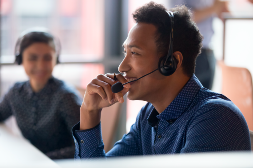 CSM talks to a client on a call