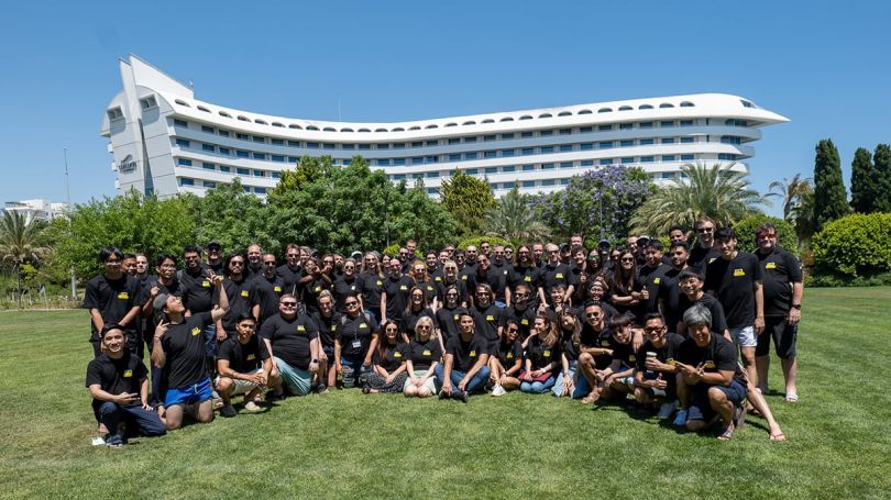 ScreenCloud group photo outside with the office building in the background