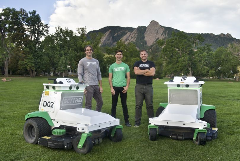 Scythe Robotics founders and the M.52 mower.