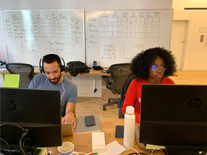 Two Sealed team members workin g in the office