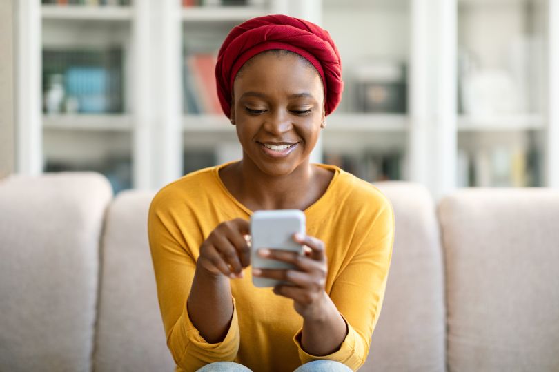 A woman using her phone to shop