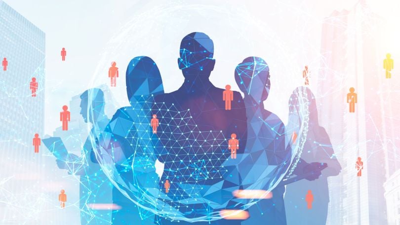 Silhouettes of people standing and graphics showing connectivity. 
