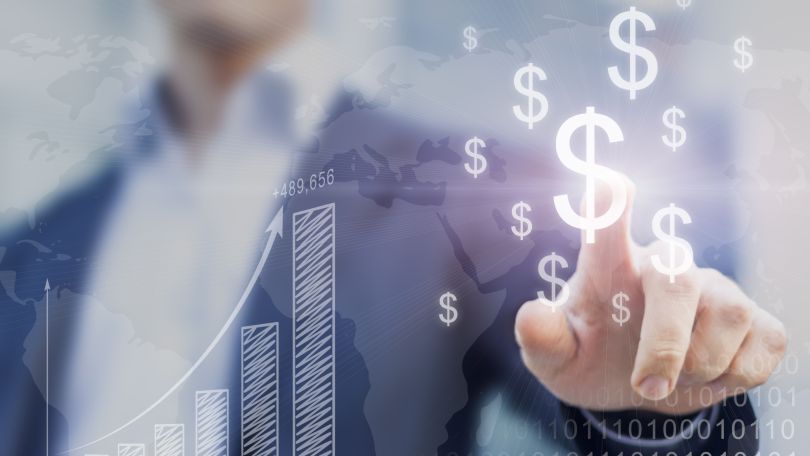 A hand reaching out to tap digital dollar signs.