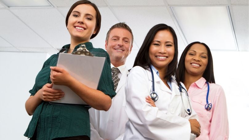 A group of medical professionals pose for a photo. 