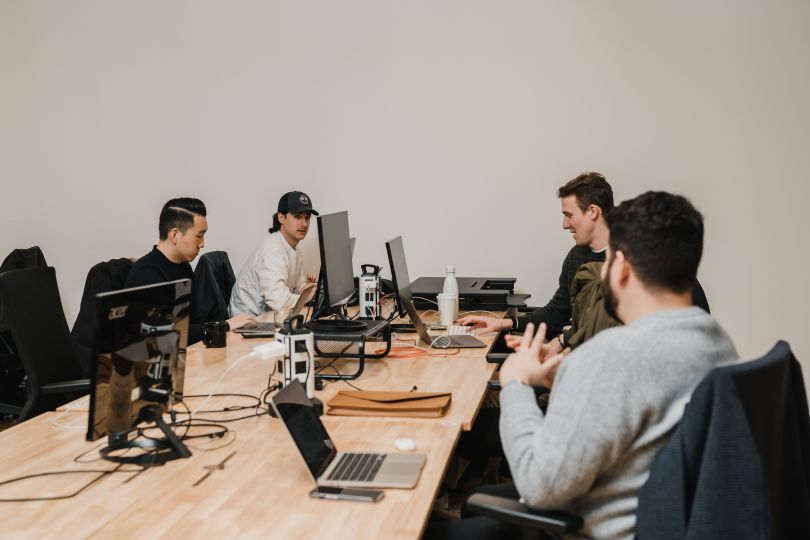 Simon Data team brainstorming in office.