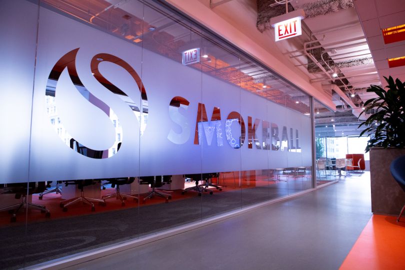 Picture of interior of Smokeball's Chicago office with logo and branding on glass wall