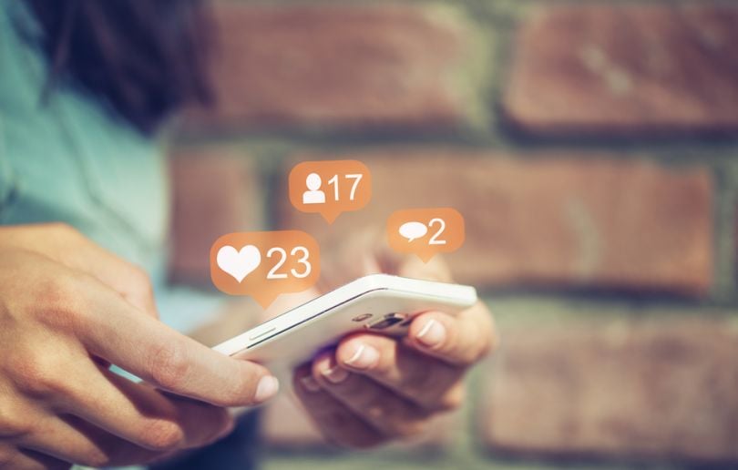 Cellphone being used with social media notifications popping up