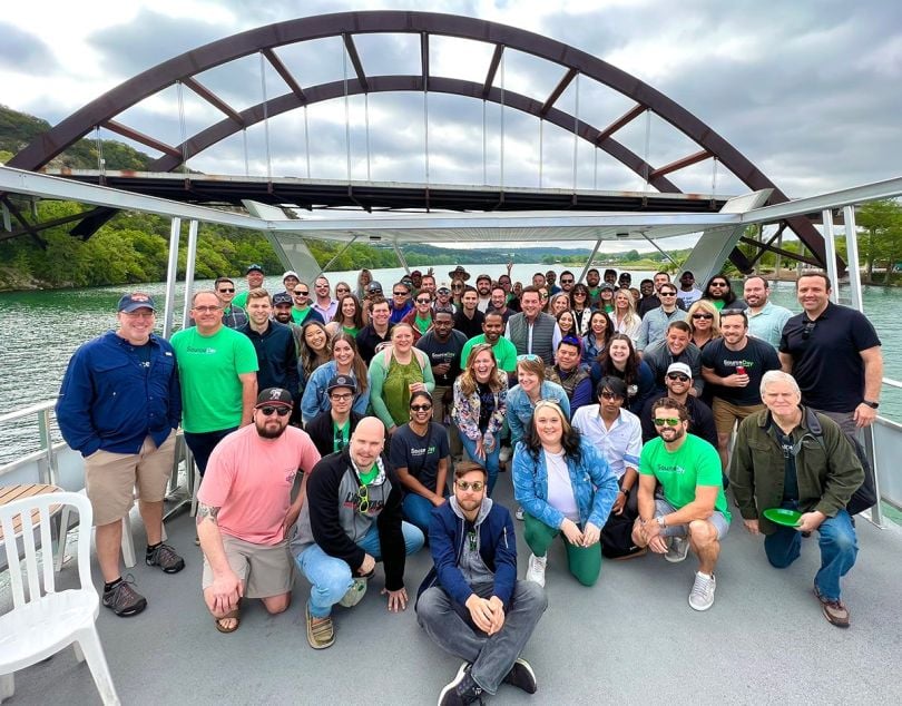 SourceDay team members on a boat
