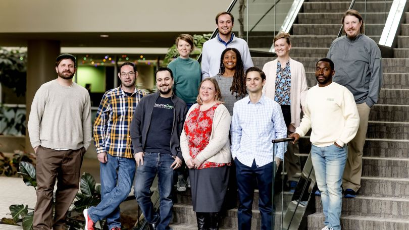 A group photo of SourceDay team members.