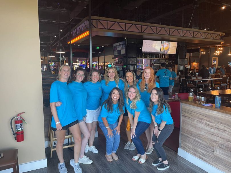 Team photo inside a restaurant.