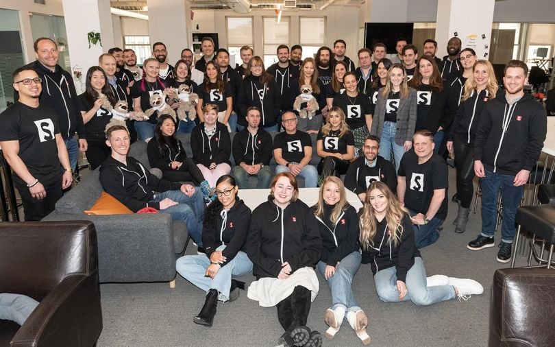 Stensul group photo with team members wearing matching t-shirts