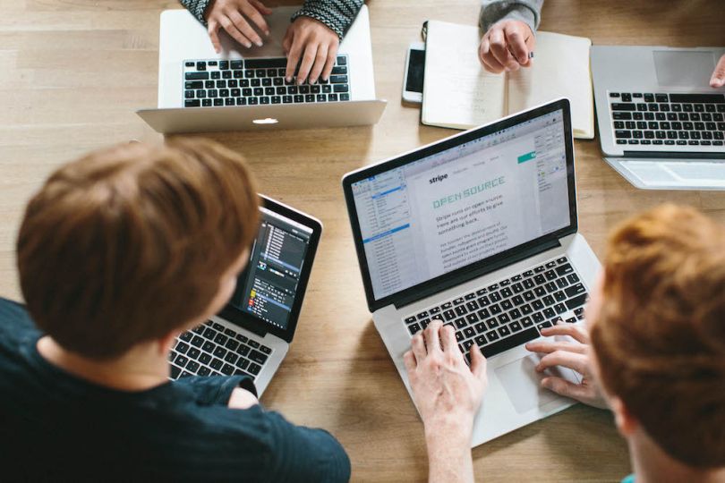 Stripe engineers collaborate during a meeting.