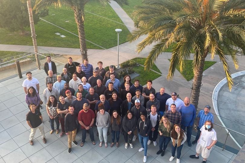 StructionSite team photo from above outside with palm trees