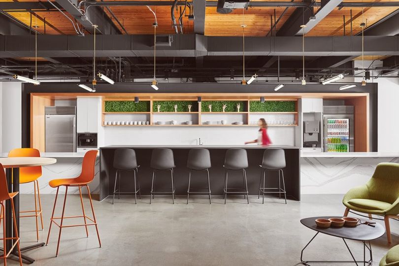 photo of Sysco LABS' kitchen area with stocked fridge, chairs and dining tables