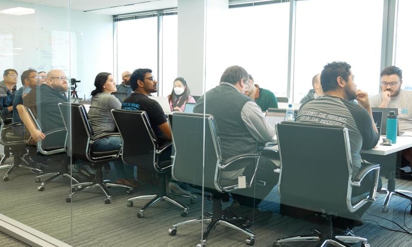 TackleAI team members having a meeting in a conference room