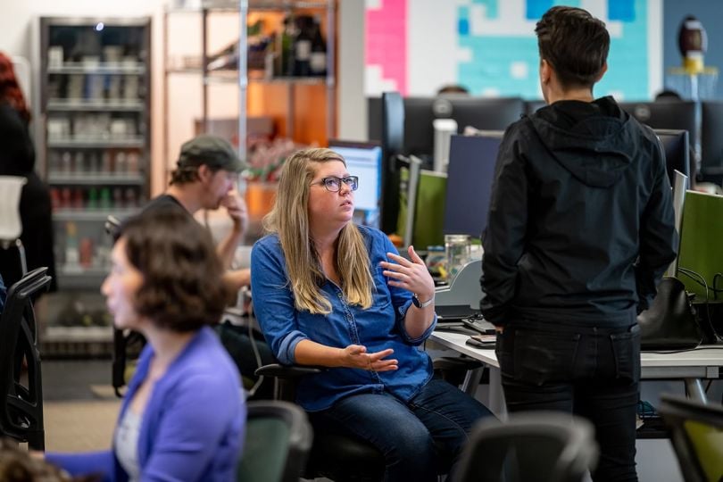 Tango Card team members working in the office