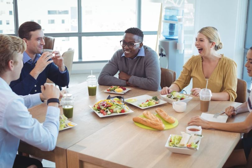 Employees eating together at lunch
