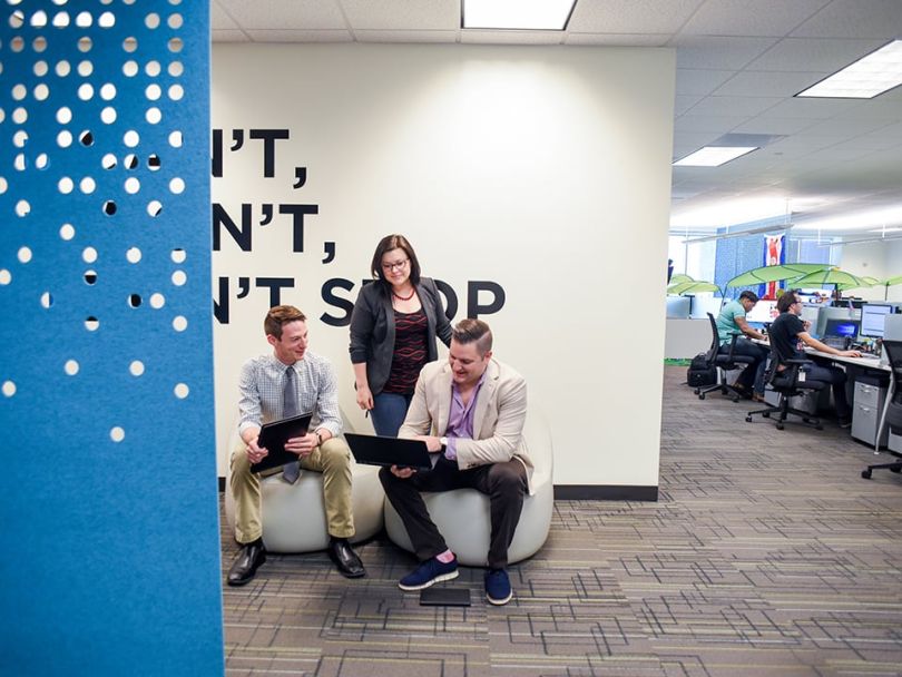 Social Solutions' team collaborating in the office