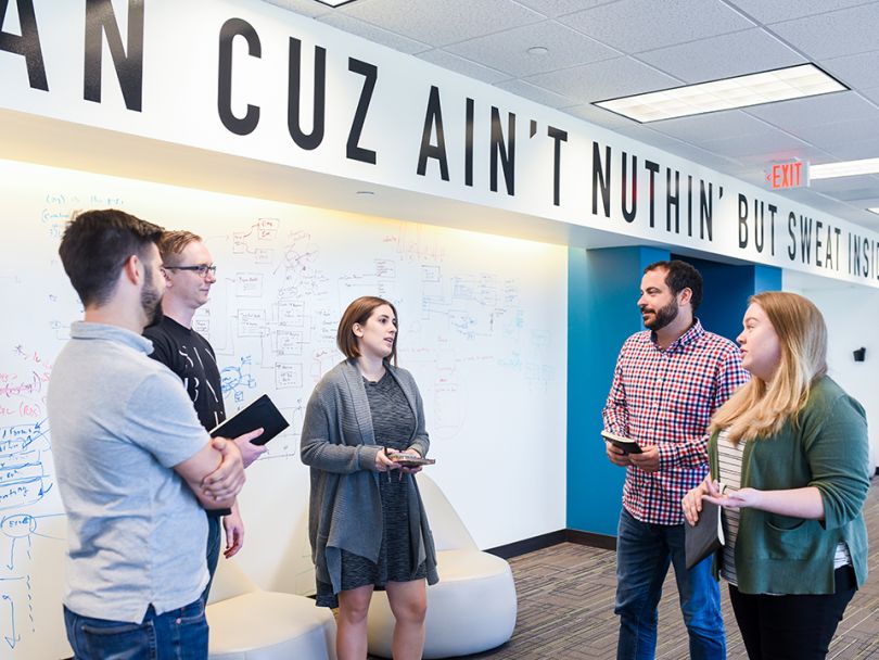 Social Solutions' team working in the office