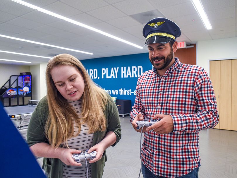 The team enjoys playing vintage video games in the office