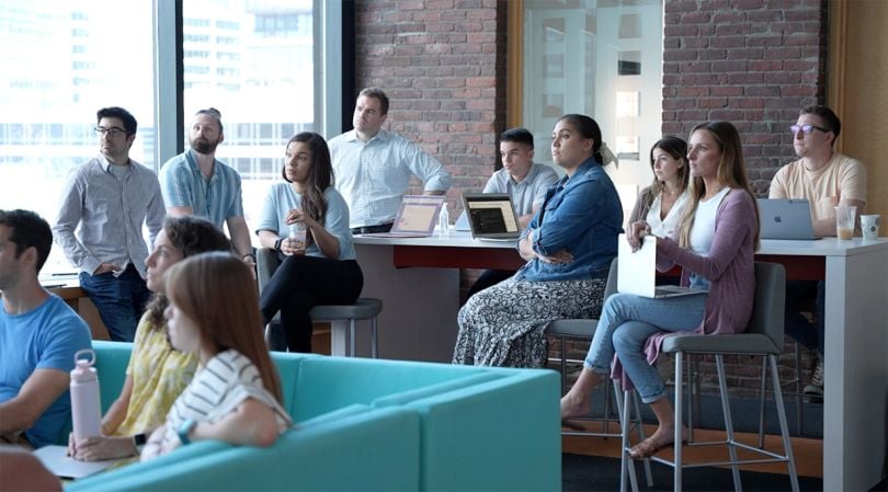 Teikametrics team having an all hands meeting in the office