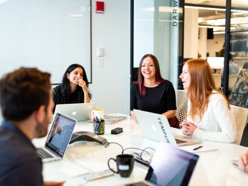 Tempus team laughing in conference room