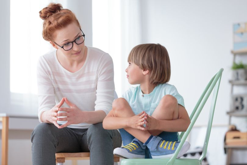 Tobogo - woman speaking to little boy
