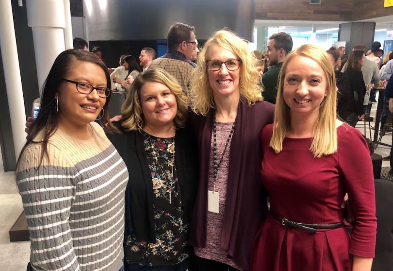 Staff at Tribune Publishing stand for a photo