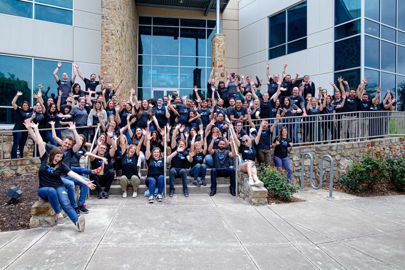 TrustRadius group photo in front of the office building