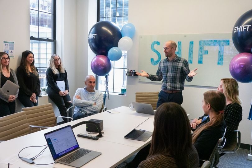 UPshow team members having a meeting in the office