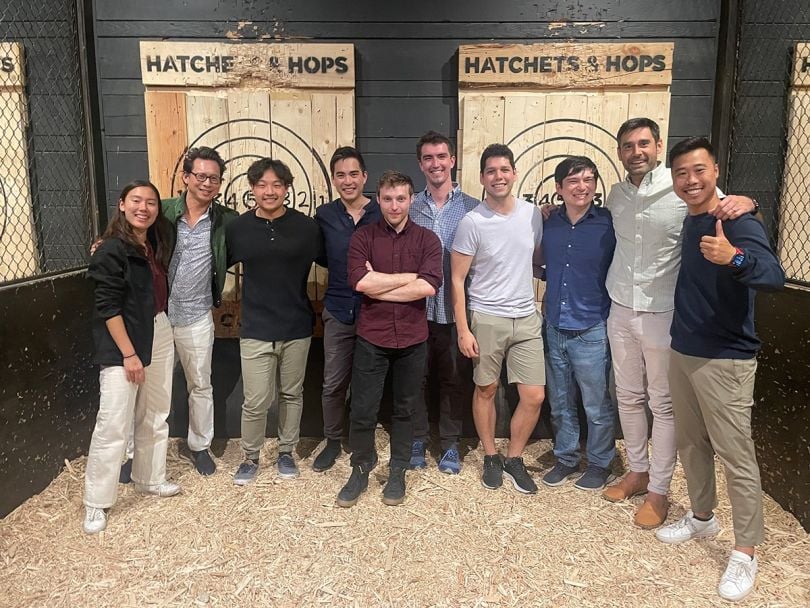 Up&Up team photo at an axe throwing establishment