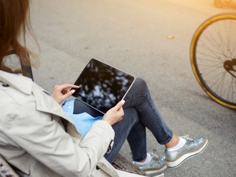 A woman views content on a mobile device