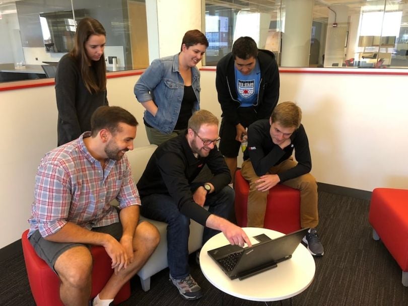 Vivid Seats data team looking at laptop